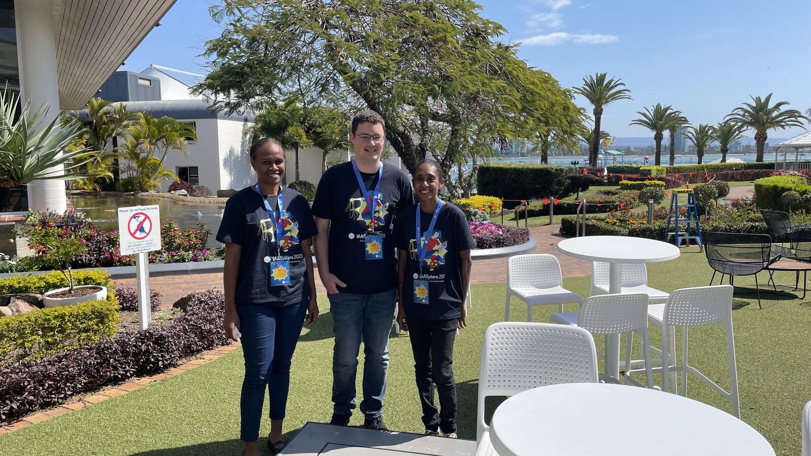 Netcraft's Adam O'Reilly with two IAA Systers delegates in
program shirts at Sea World on the Gold Coast
